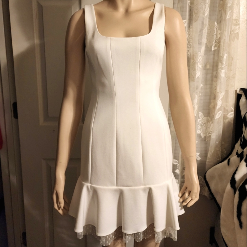 BCBG Maxazria white sleeveless mini dress with ruffled polkadot tulle. Size 4